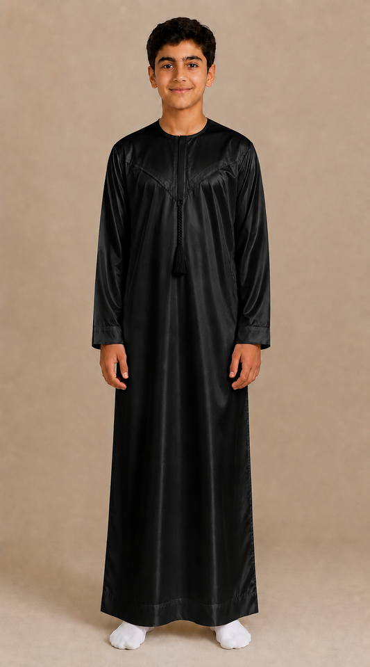 Boy wearing black shiny jubba with removable tassel