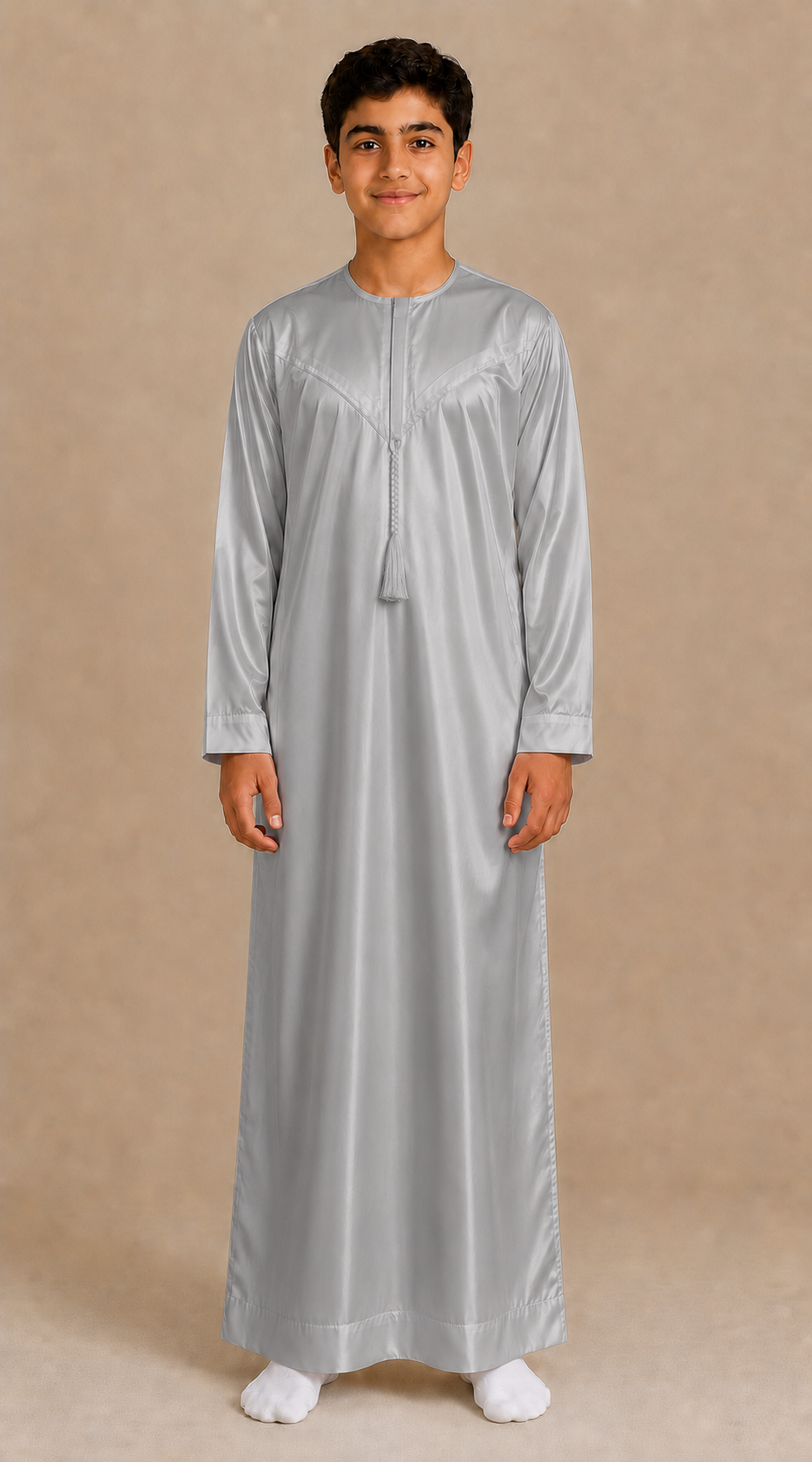 Boy wearing silver grey shiny jubba with removable tassel