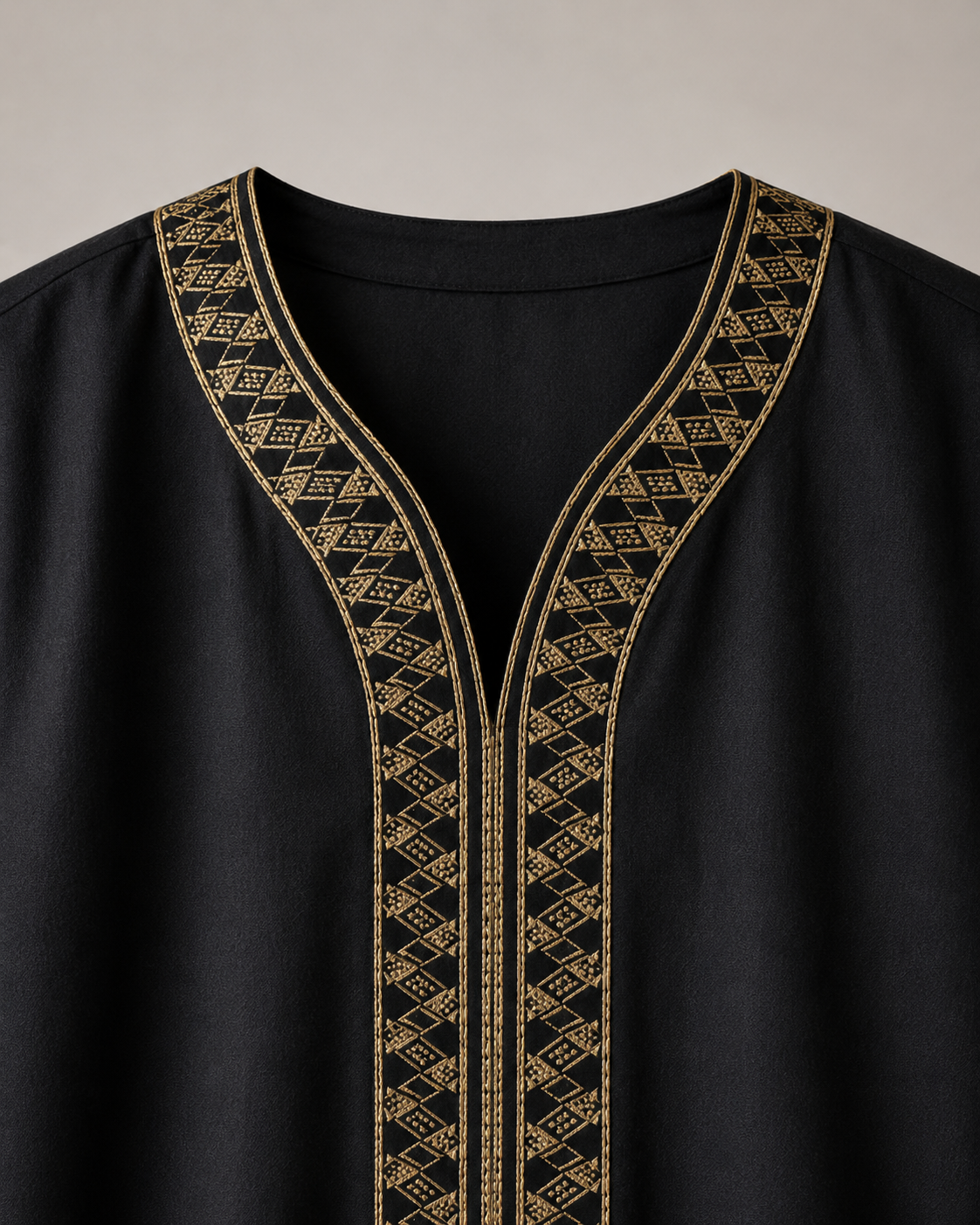 Black Moroccan jubba gold embroidered neckline close-up